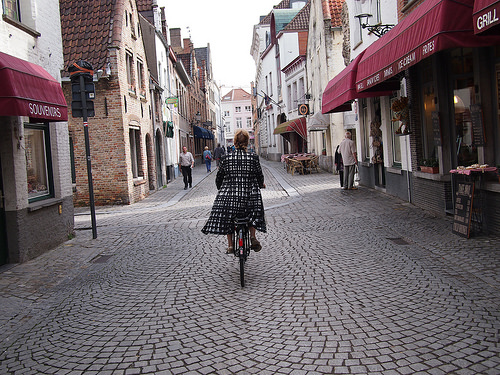 Follow that woman. She will lead you to beer